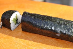 Photo of cutting sushi roll