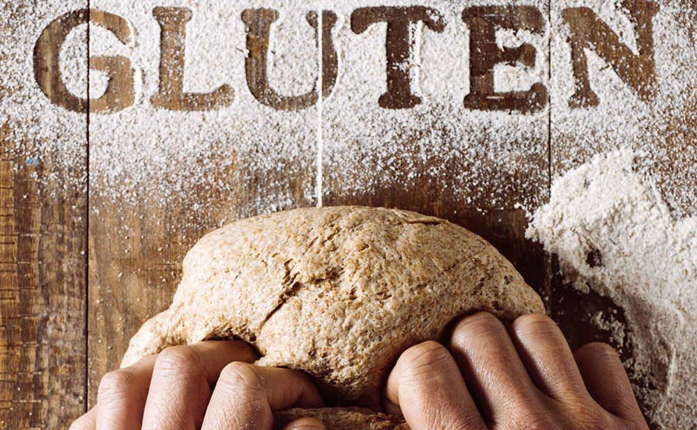 Image of hands kneading gluten free bread.
